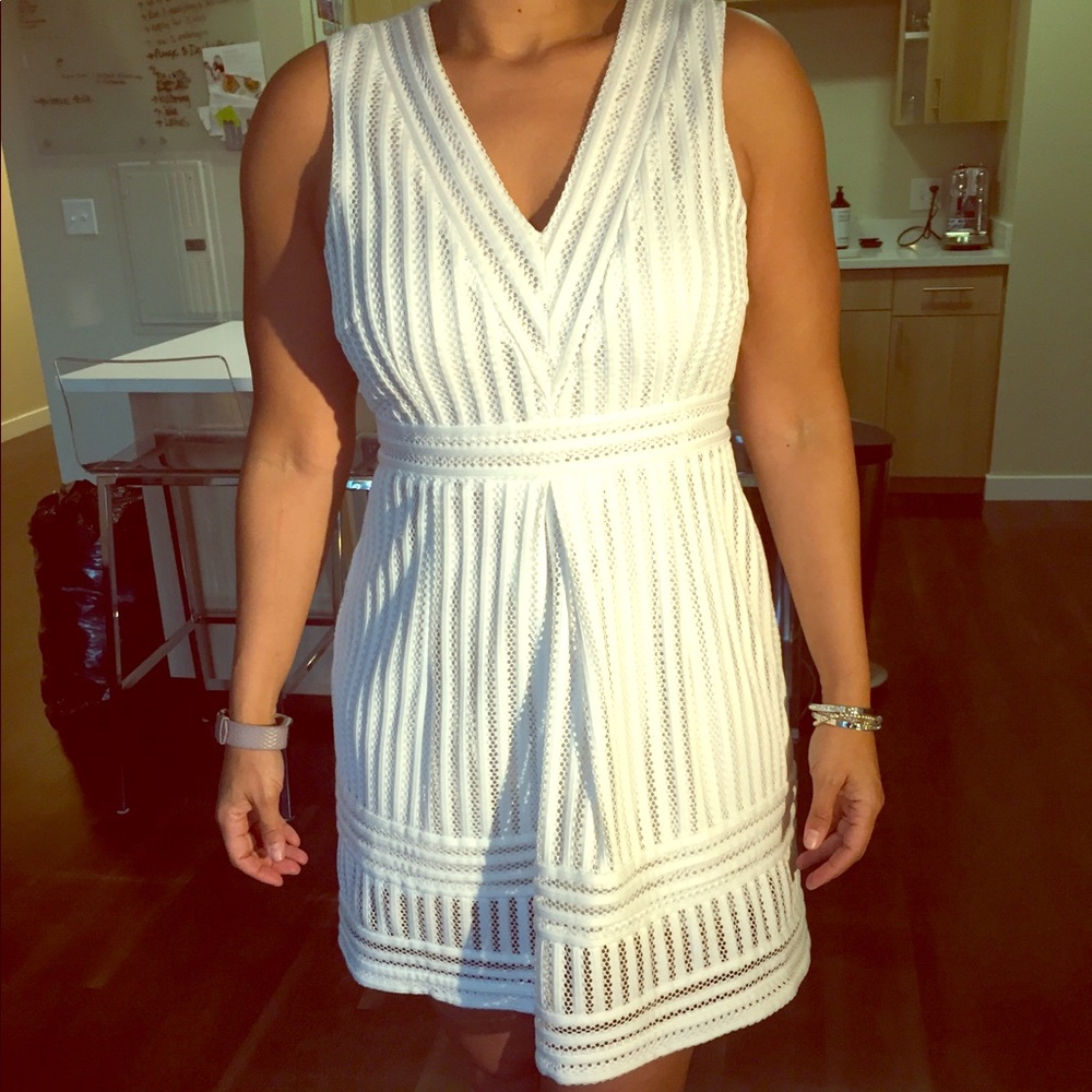 SOLD! Sleeveless, fit and flare V-Neck White Dress